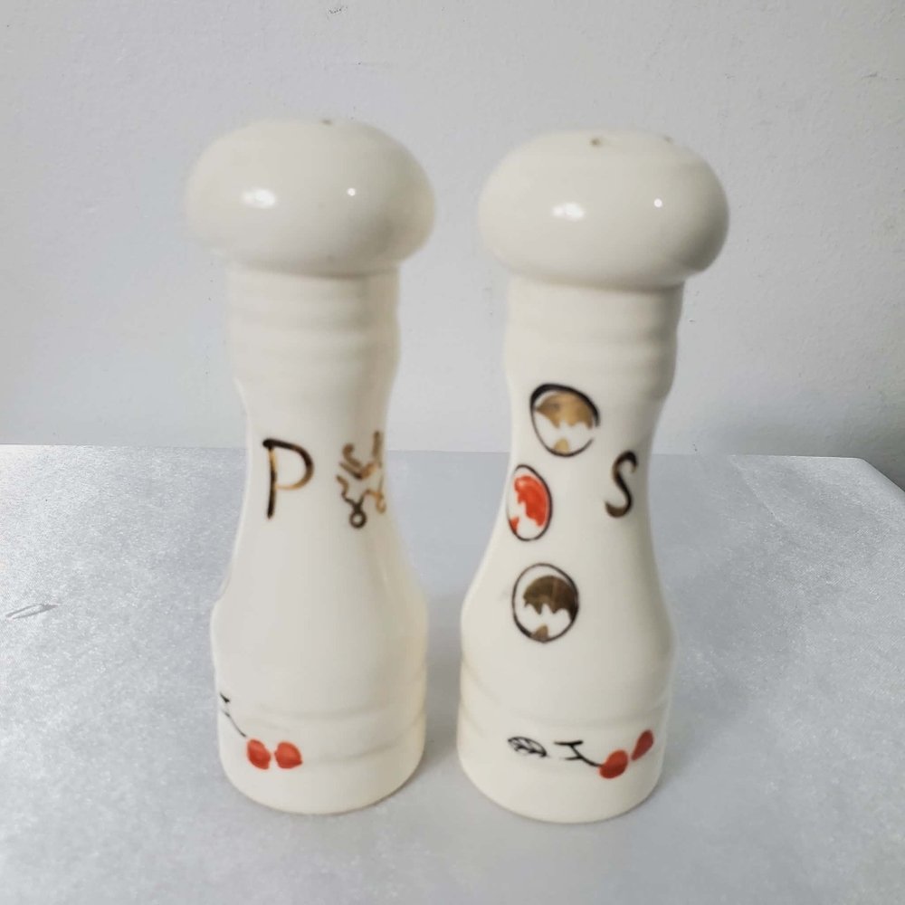 Pair of vintage ceramic salt and pepper shakers, likely made in Japan